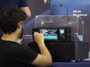 The ARRL Sweepstake Icom Dream Station is prepared for visitors to see by John McAuliffe, W1DRF, ARRL Lab Digital RF Engineer. [Video still by Greg Sulla]. 