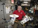 Fyodor Yurchikhin, RN3FI, holds the Tanyusha-1 and 2 cubesats.