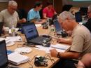 Participants in the Teachers Institute at ARRL Headqurters program their robots. [S. Khrystyne Keane, K1SFA, Photo]