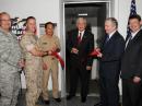 Former Defense Department Chief Information Officer John Grimes (with scissors) cuts the ribbon, ceremonially opening the new MARS station in the Pentagon. [Sally Sobsey, Department of Defense, Photo]
 