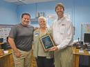 ARRL Contest Branch Manager and President of W1HQ Sean Kutzko, KX9X (right), presents ICOM's Amateur and Receiver Products Division Manager Ray Novak, N9JA (left), and ICOM Sales Representative Pat Marcy, W7PZ, with a plaque, thanking ICOM for its support of ARRL stations W1AW and W1HQ. [S. Khrystyne Keane, K1SFA, Photo]