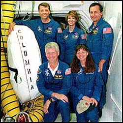 The STS-93 crew prior to launch. Back row (l-r): Pilot Jeff Ashby, Commander Eileen Collins, KD5EDS, and Mission Specialist Michel Tognini, KD5EJZ, of France. Front row (l-r): Mission Specialists Steven Hawley, and Cady Coleman, KC5ZTH. [NASA photo]