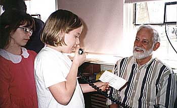 Sarah Littrell speaks with astronaut Laurel Clark while Kimberly Weiss awaits her turn.