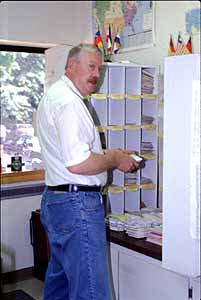 ARRL Outgoing QSL Service Manager Martin Cook, N1FOC, sorts some of the nearly six tons of QSL cards that passed through the Service's hands last year.