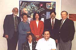 (L-R standing) ARISS Project Manager John Nickel, WD5EEV; Karen Nickel, WD5EEU; Rosalie White, WA1STO; ARISS Administrative Chairman Frank Bauer, KA3HDO, and SAREX Working Group Chairman Roy Neal, K6DUE; (in front) Carolynn Conley of NASA and SAREX Principal Investigator Matt Bordelon, KC5BTL, at Johnson Spaceflight Center in Houston.